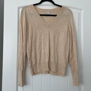 Cream colored, long sleeve, v-neck sweater, size M